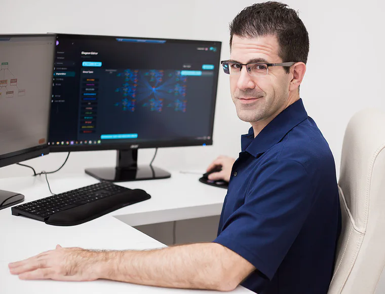 Ron Spinabella at his desk